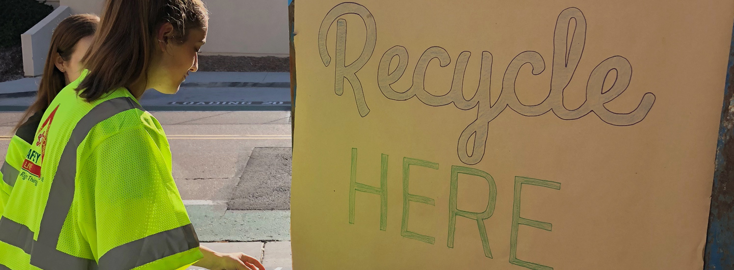 students volunteering at a recycling program